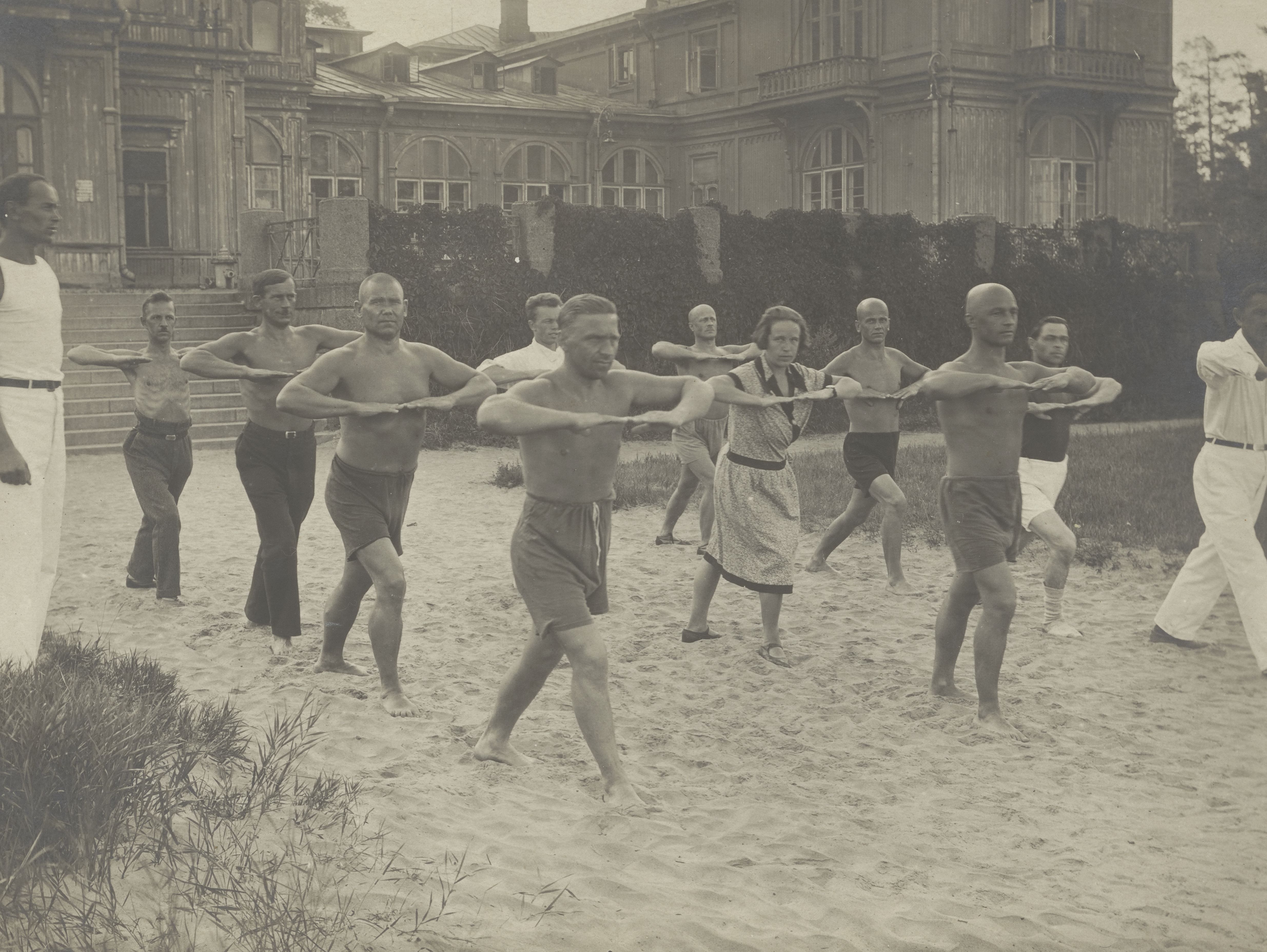 Photograph of a group of adults exercising, 1932